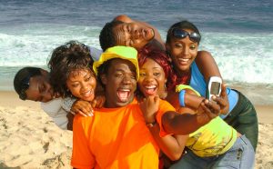 Advertising lifestyle photography of friends taking a selfie at the beach in Lagos Nigeria