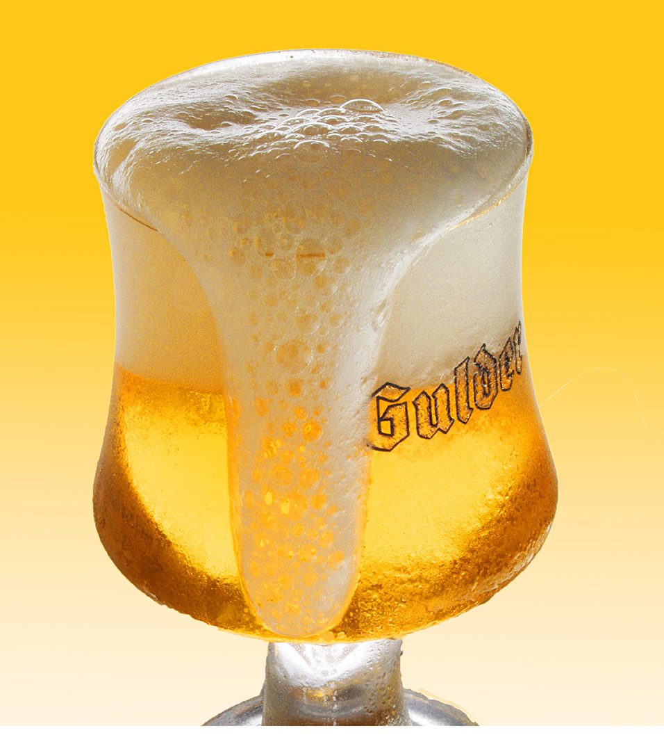 Beer glass with rich foam captured for beverage product advertising photography in Lagos