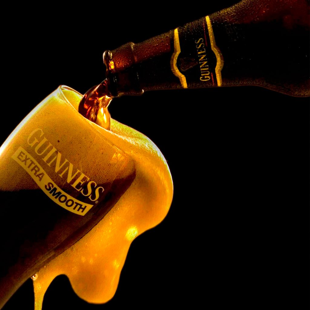 Beverage product advertising photography of Guinness beer pouring into a glass in Lagos Nigeria