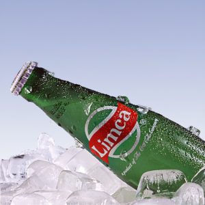 Limca beverage bottle on ice with water droplets photographed for advertising in Lagos Nigeria
