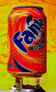 Fanta orange beverage can with condensation in creative advertising photography style