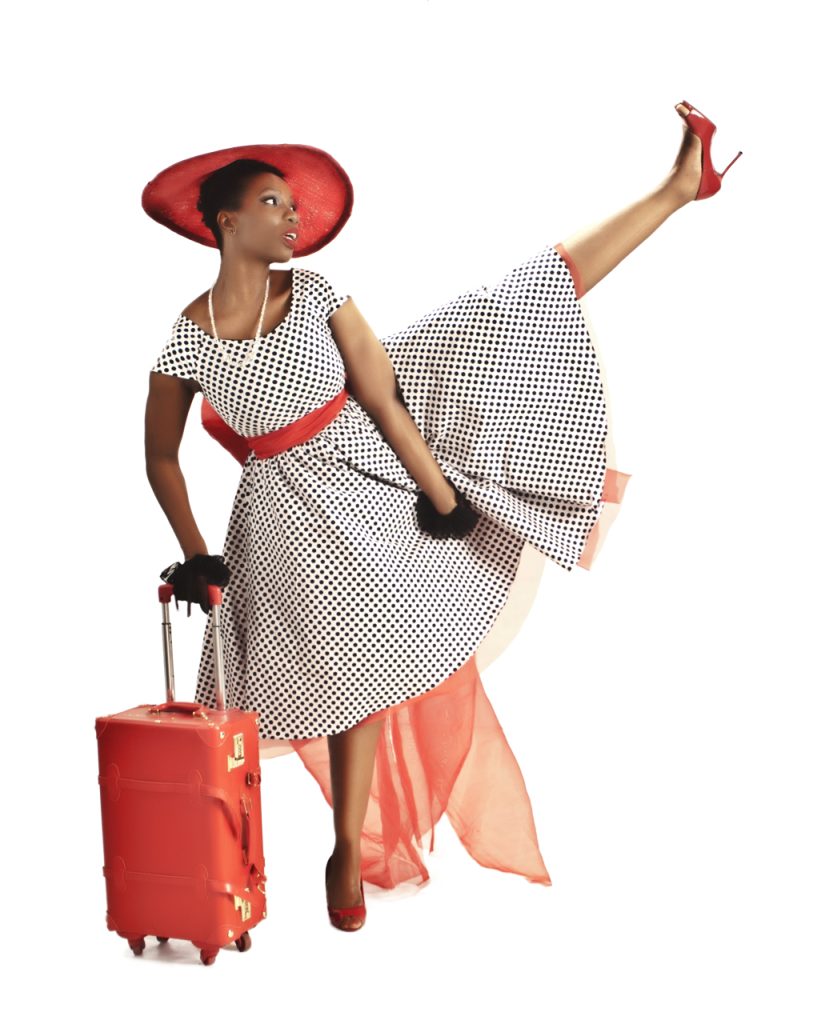 Fashion lifestyle advertising photography of a stylish woman with a suitcase in Lagos Nigeria