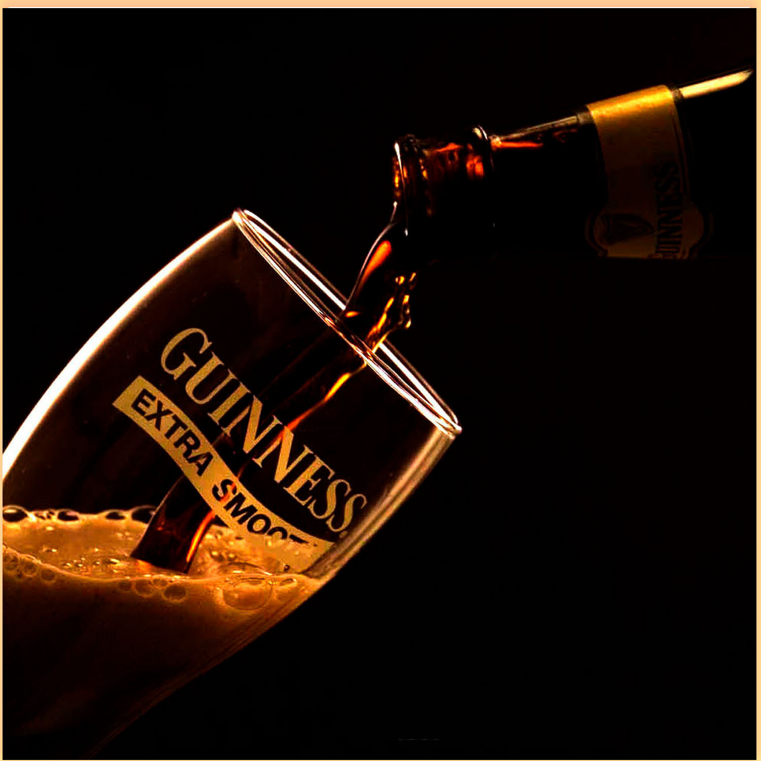 Creative beverage photography of Guinness beer being poured into a glass with dramatic lighting in Lagos Nigeria