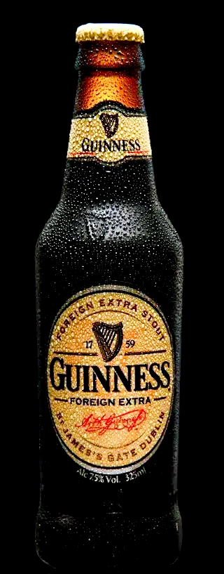 Guinness beer bottle with condensation drops on a dark background for product advertising photography