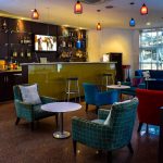 modern hotel bar lounge interior with seating area and ambient lighting