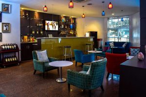 modern hotel bar lounge interior with seating area and ambient lighting