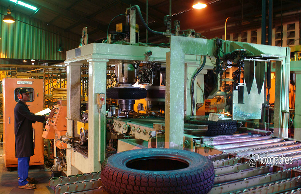 industrial factory tyre production line with machinery and operator in Nigeria manufacturing plant