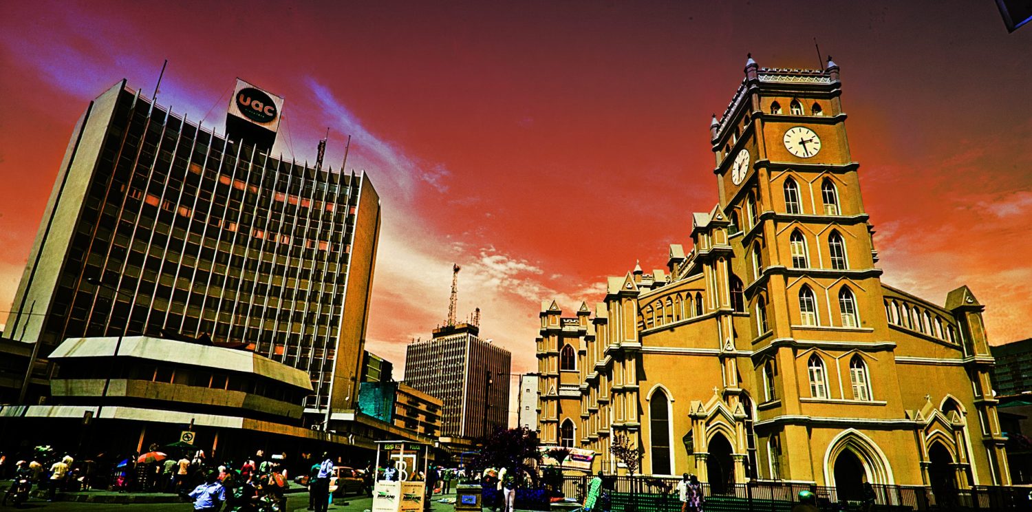 Iconic Lagos cityscape featuring Cathedral Church and UAC building captured in vibrant urban photography by Emmanuel Ologeh of C&G Photographers