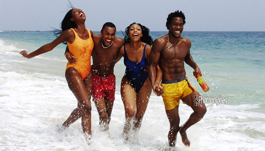 Friends celebrating at the beach captured for lifestyle advertising photography in Lagos