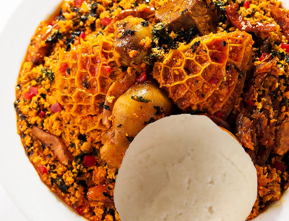 Pounded yam and egusi soup captured for Nigerian food product advertising photography in Lagos