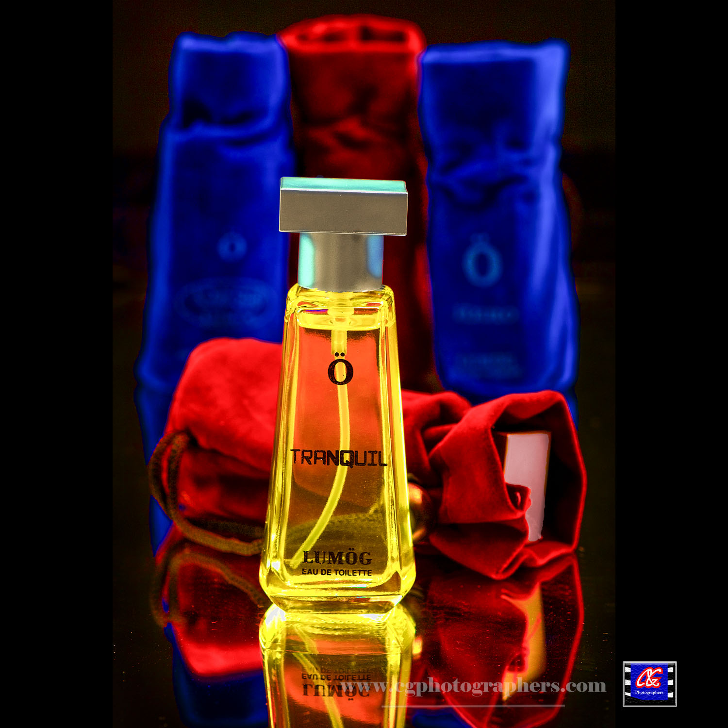 Perfume bottle with red and blue fabric for product advertising photography